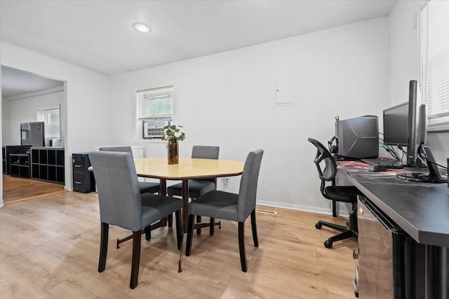 dining space featuring light wood-type flooring