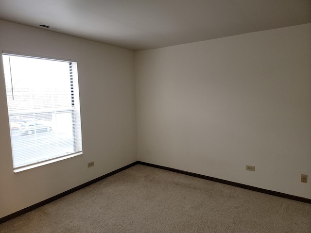 bedroom with multiple windows and carpet