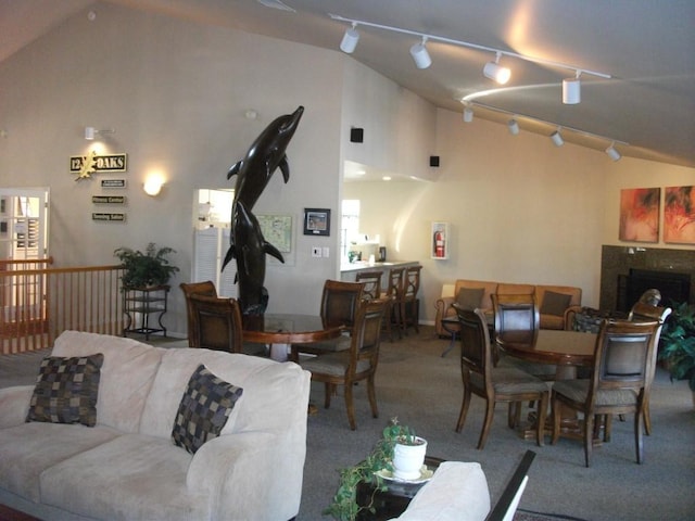 carpeted dining area with french doors and lofted ceiling