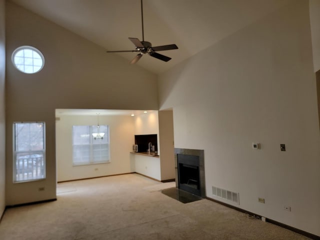 dining room with light colored carpet, a notable chandelier, and sink