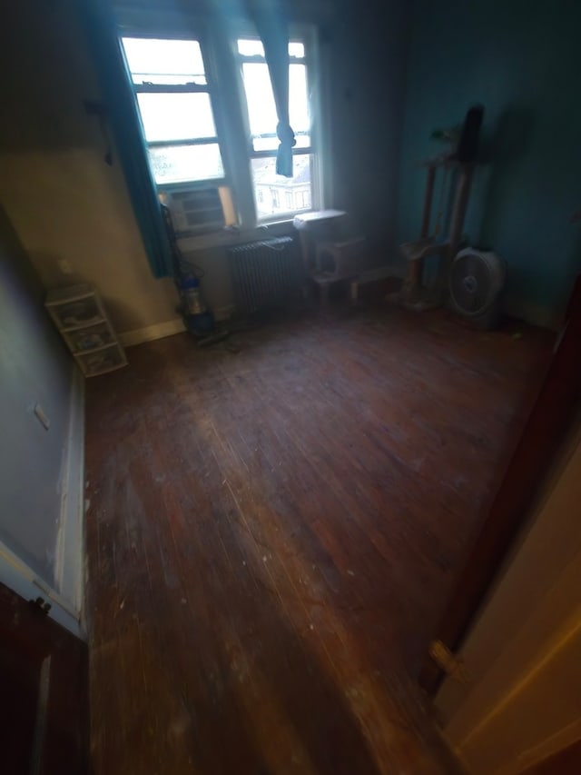 interior space featuring dark hardwood / wood-style flooring and radiator