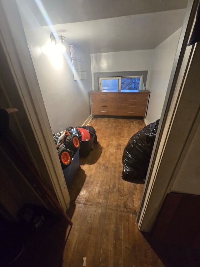 bedroom with hardwood / wood-style flooring