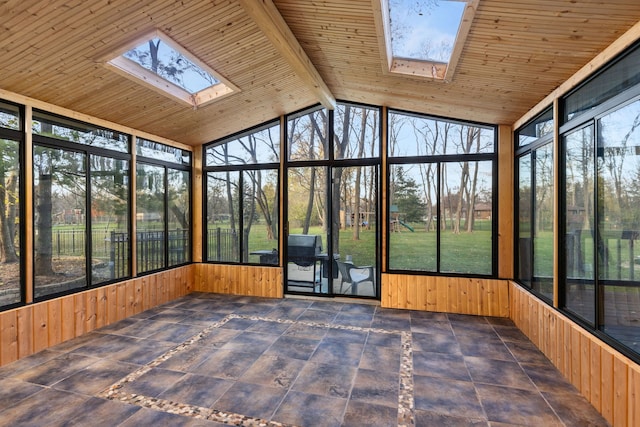 unfurnished sunroom with wood ceiling and lofted ceiling with skylight