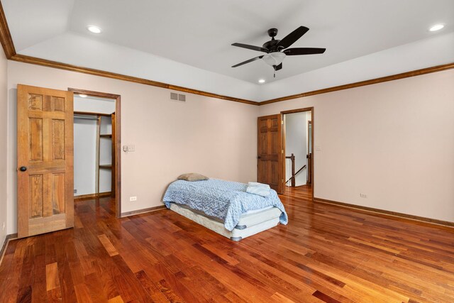 bedroom with ceiling fan, ensuite bathroom, wood-type flooring, access to outside, and ornamental molding