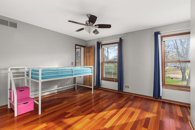 unfurnished bedroom with dark hardwood / wood-style flooring