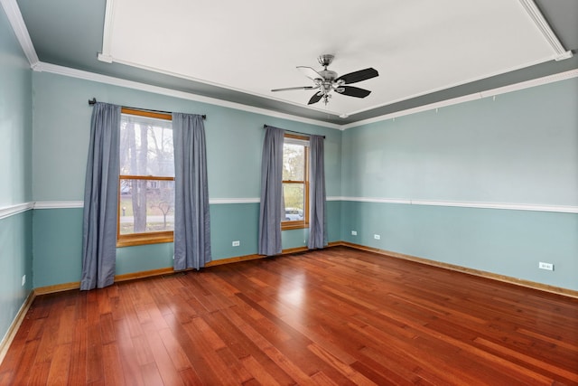 unfurnished room featuring ceiling fan, hardwood / wood-style flooring, crown molding, and a healthy amount of sunlight