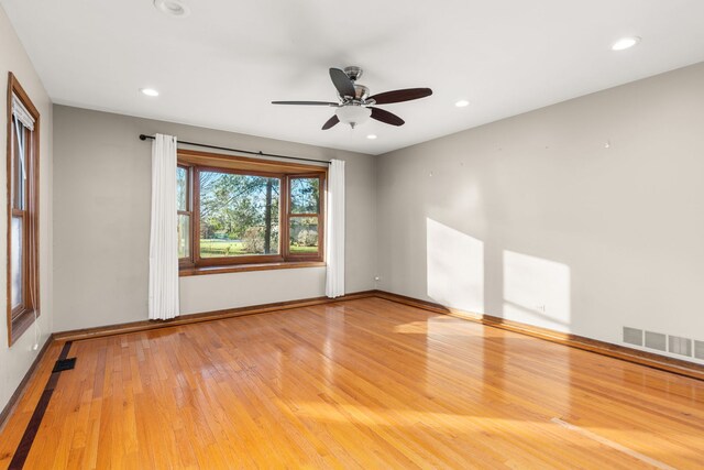 living area featuring light wood-type flooring and a chandelier