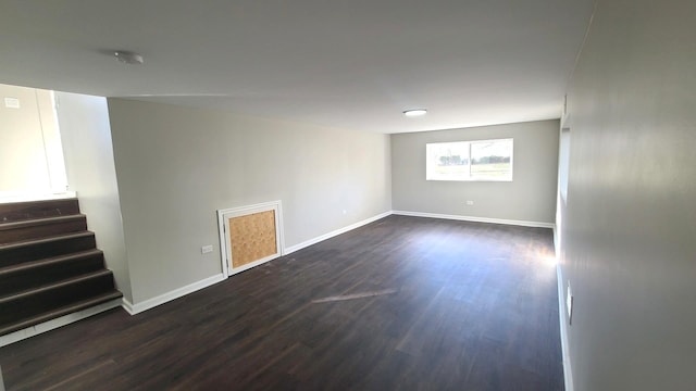 empty room featuring dark wood-type flooring