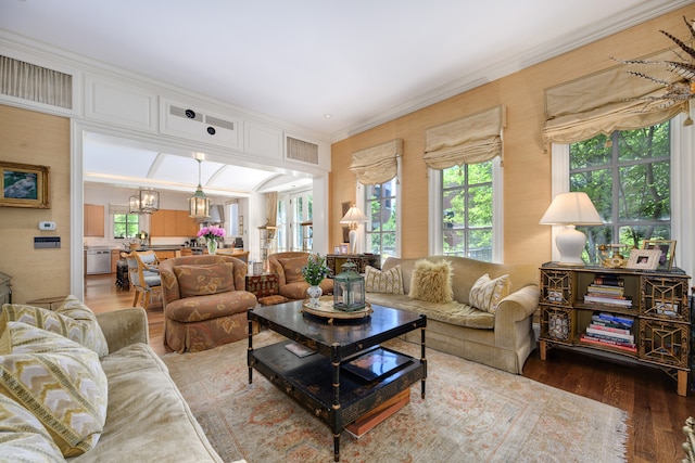 living room with ornamental molding and hardwood / wood-style floors