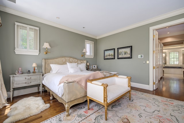 bedroom featuring ornamental molding and light hardwood / wood-style flooring