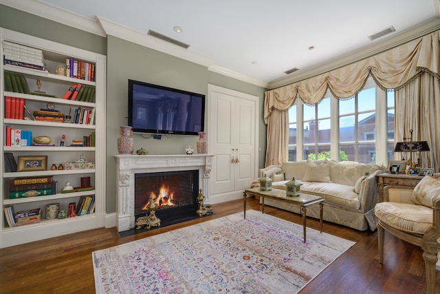 living room with dark hardwood / wood-style floors and ornamental molding