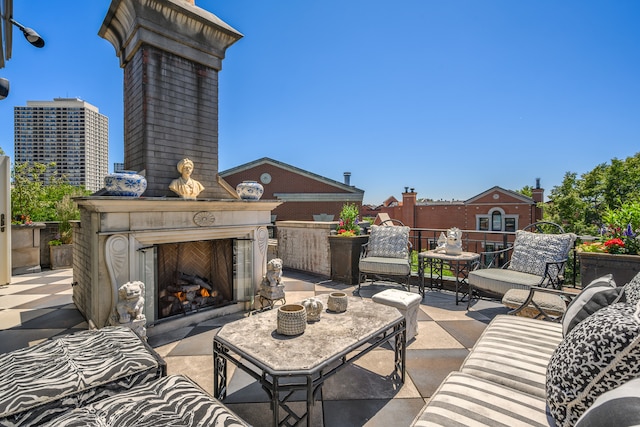 view of patio / terrace featuring an outdoor fireplace