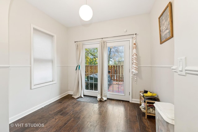 doorway with dark hardwood / wood-style flooring