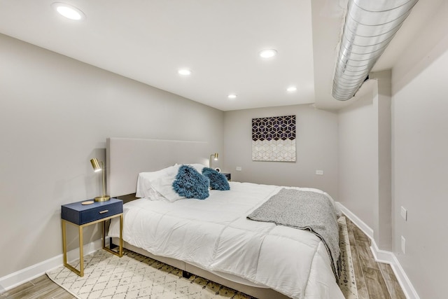 bedroom featuring wood-type flooring