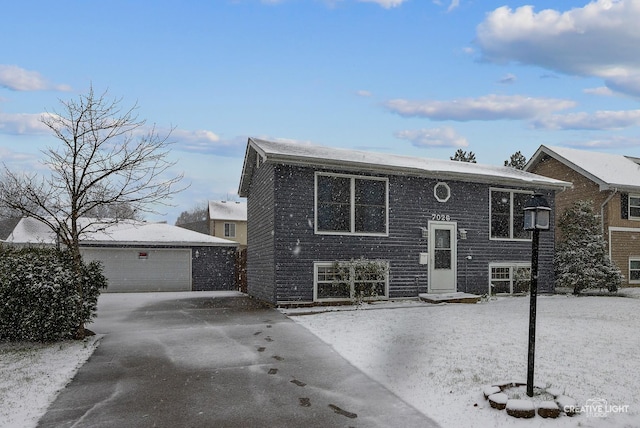 view of front facade with an outdoor structure and a garage