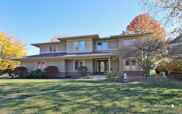 prairie-style house featuring a front yard