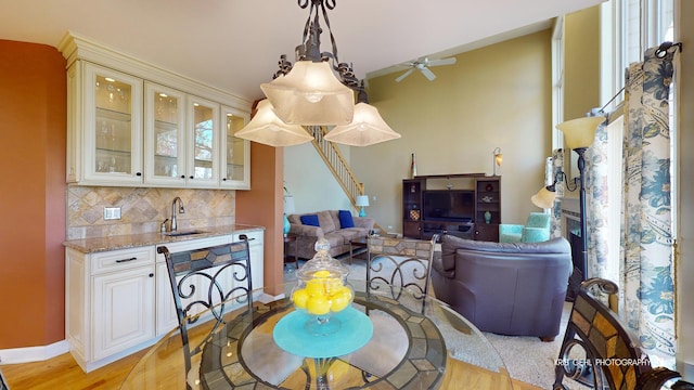 dining space featuring sink and light hardwood / wood-style floors