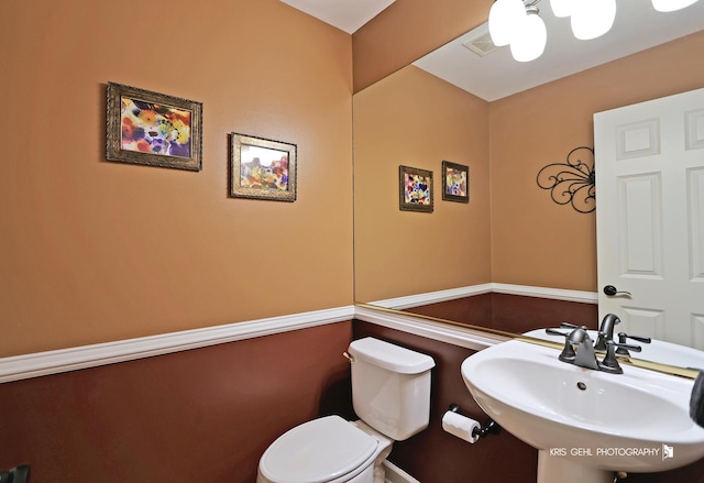 bathroom featuring sink and toilet