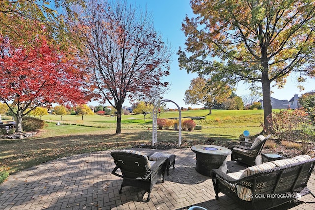 view of patio with an outdoor fire pit