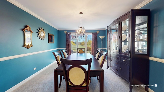 carpeted dining room with crown molding and an inviting chandelier