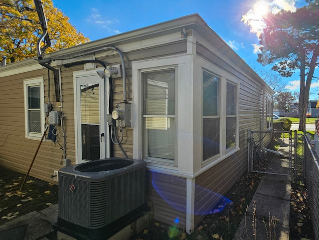 view of side of property featuring central air condition unit