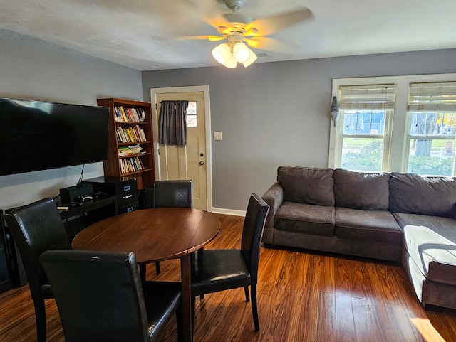 dining room featuring ceiling fan and dark hardwood / wood-style flooring