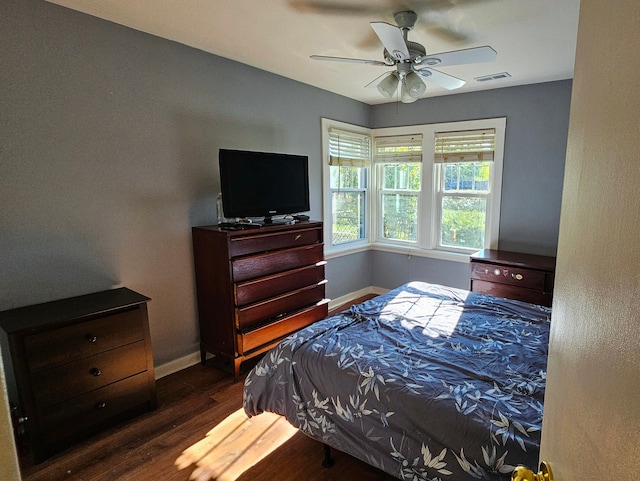 bedroom featuring dark wood-type flooring and ceiling fan