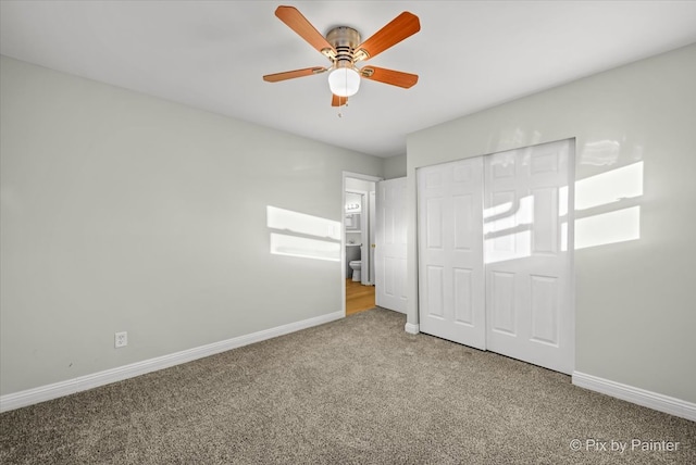 unfurnished bedroom featuring carpet floors, a closet, and ceiling fan