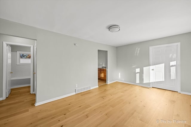 unfurnished living room featuring light hardwood / wood-style flooring