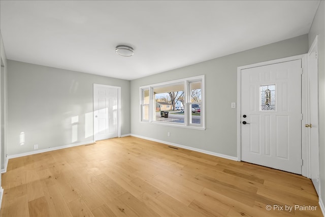 entryway with light hardwood / wood-style flooring