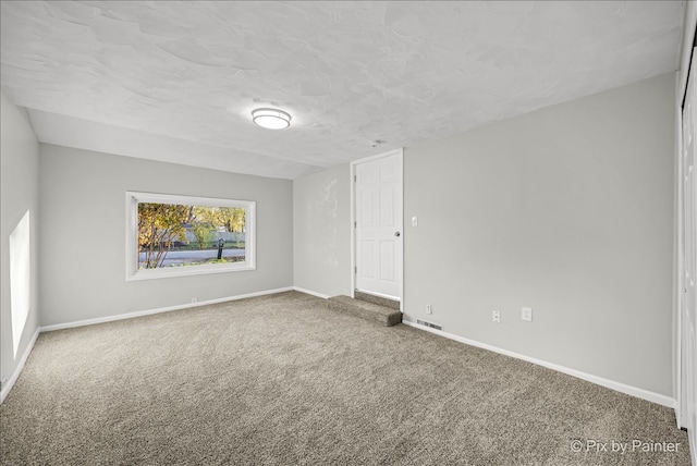 unfurnished room with carpet