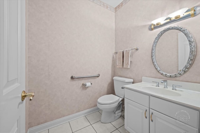 bathroom with tile patterned floors, vanity, and toilet