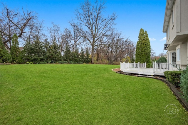 view of yard with a wooden deck