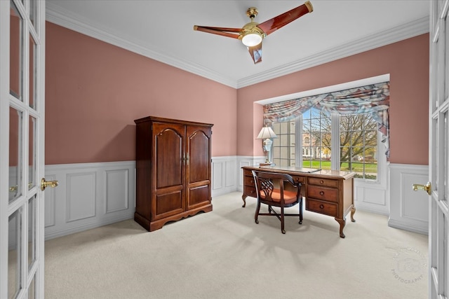 carpeted office featuring crown molding, french doors, and ceiling fan