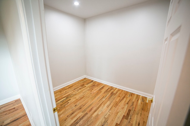 empty room with hardwood / wood-style floors