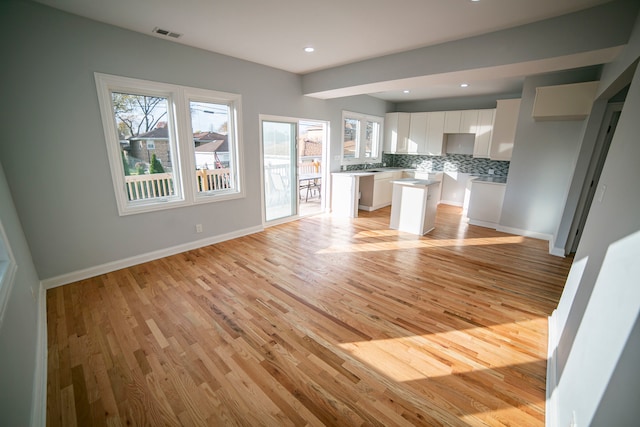 unfurnished living room featuring light wood-type flooring