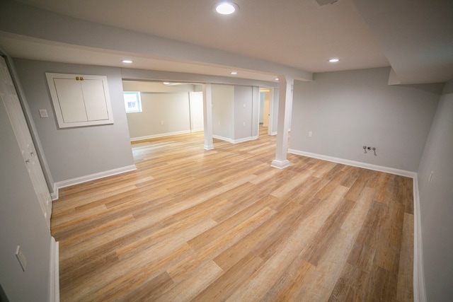 basement featuring light wood-type flooring