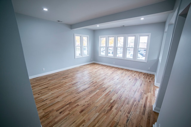 spare room with light hardwood / wood-style floors