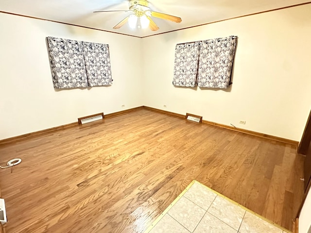 unfurnished room featuring ceiling fan and hardwood / wood-style flooring