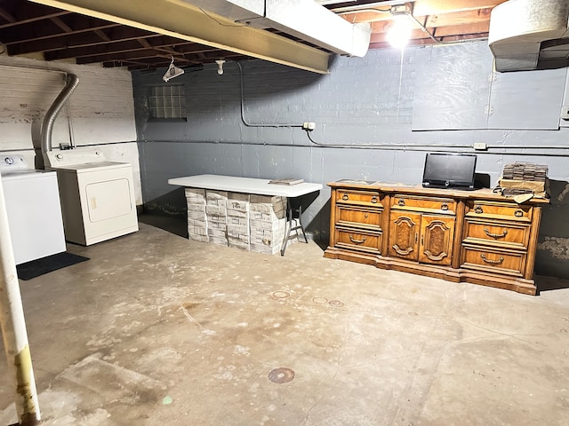 basement with washing machine and clothes dryer