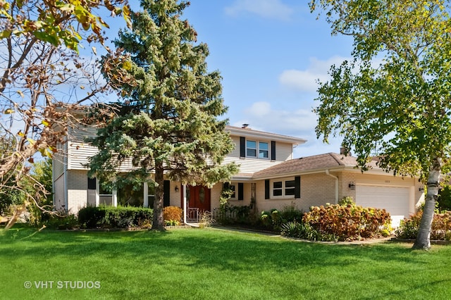 view of front facade with a front lawn and a garage