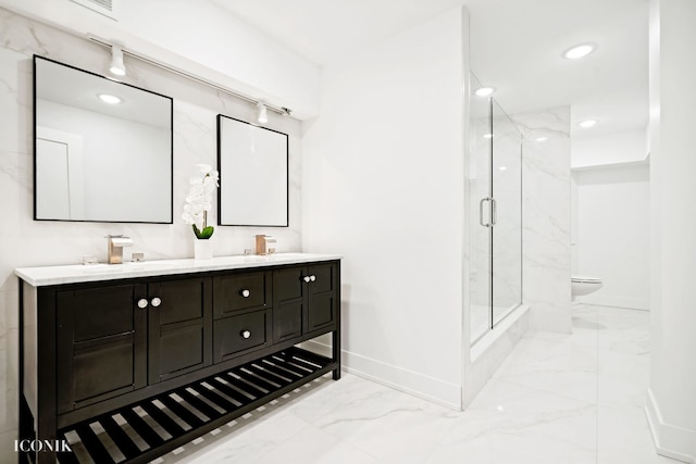 full bathroom featuring baseboards, a sink, toilet, a marble finish shower, and marble finish floor