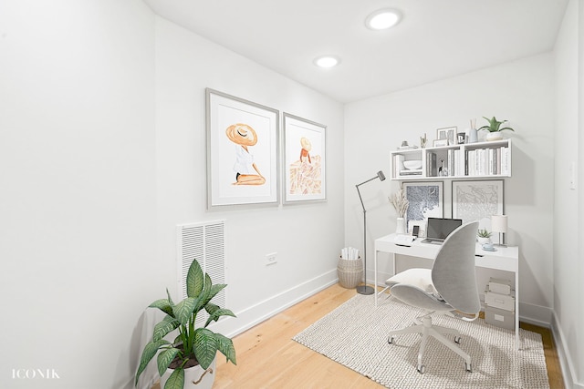 home office featuring baseboards, recessed lighting, and wood finished floors