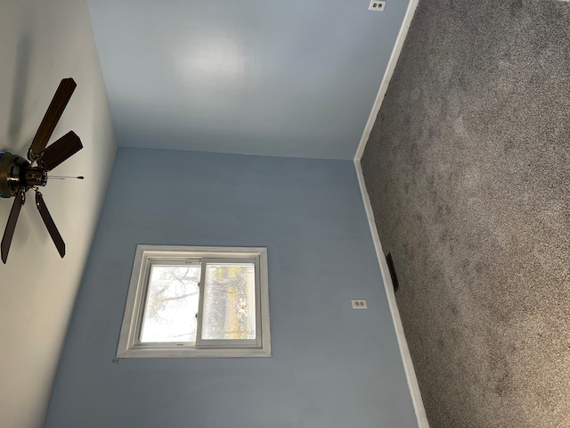 carpeted empty room with ceiling fan