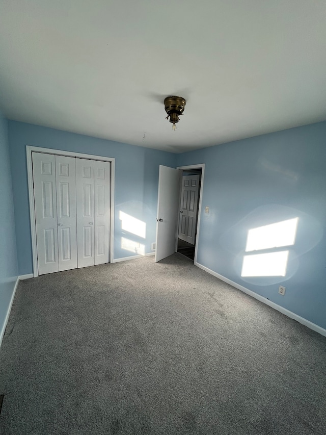 unfurnished bedroom with carpet floors