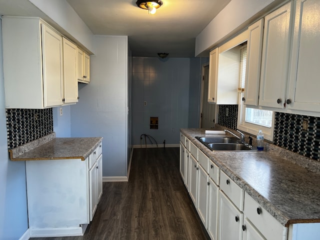 kitchen with sink, dark hardwood / wood-style floors, and white cabinets