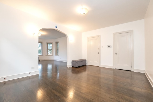 interior space with dark hardwood / wood-style floors