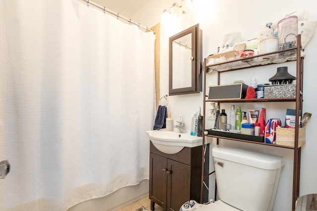 full bathroom with toilet, tile patterned floors, shower / bath combo, and vanity