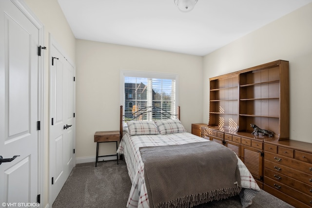 bedroom with dark carpet