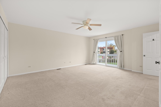 unfurnished bedroom with ceiling fan, light carpet, and access to exterior